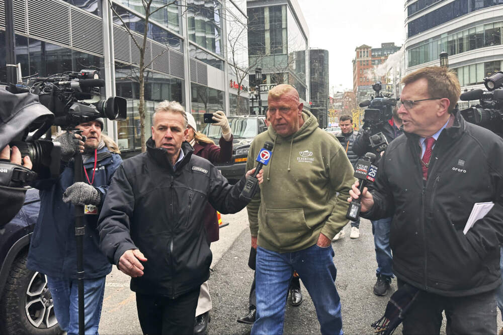 Massachusetts State Police Sgt. Gary Cederquist, center, leaves federal court on Tuesday, Jan. 30. (Michael Casey/AP)