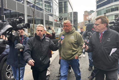 Massachusetts State Police Sgt. Gary Cederquist, center, leaves federal court on Tuesday, Jan. 30. (Michael Casey/AP)
