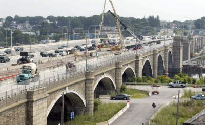Construction crews work on the eastbound lanes of the Washington Bridge in Providence, R.I., Aug. 4, 2007. (Stew Milne/AP)
