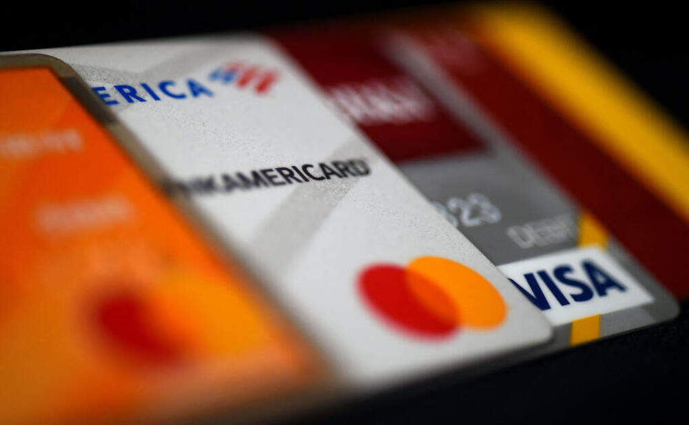 This illustration picture shows debit and credit cards arranged on a desk on April 6, 2020 in Arlington, Virginia. (OLIVIER DOULIERY/AFP via Getty Images)