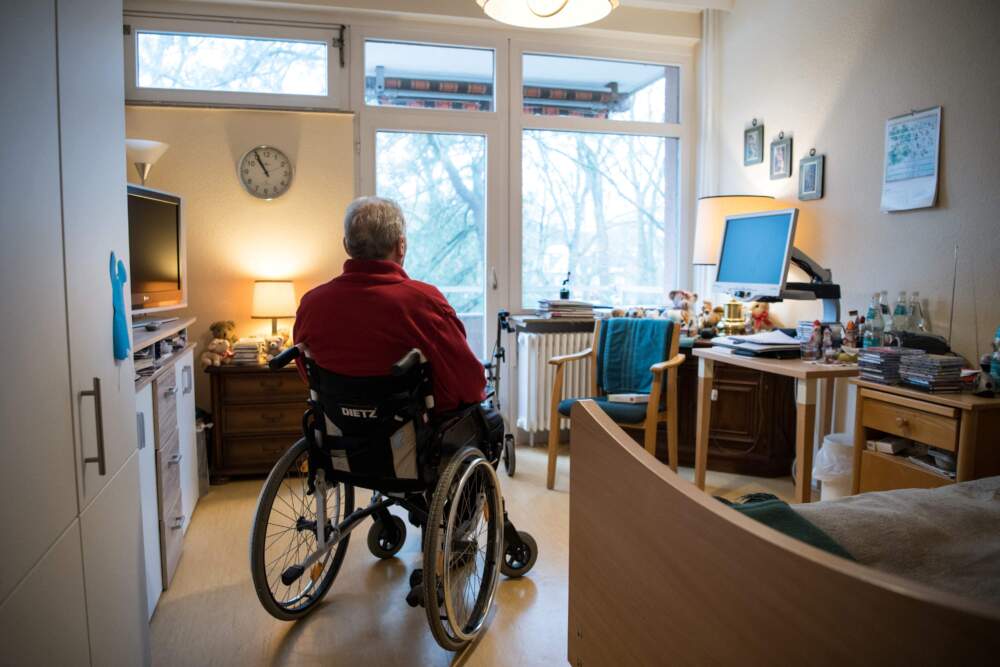 A resident sits in a wheelchair in his room in a nursing home. (Stefanie Loos/AFP via Getty Images)