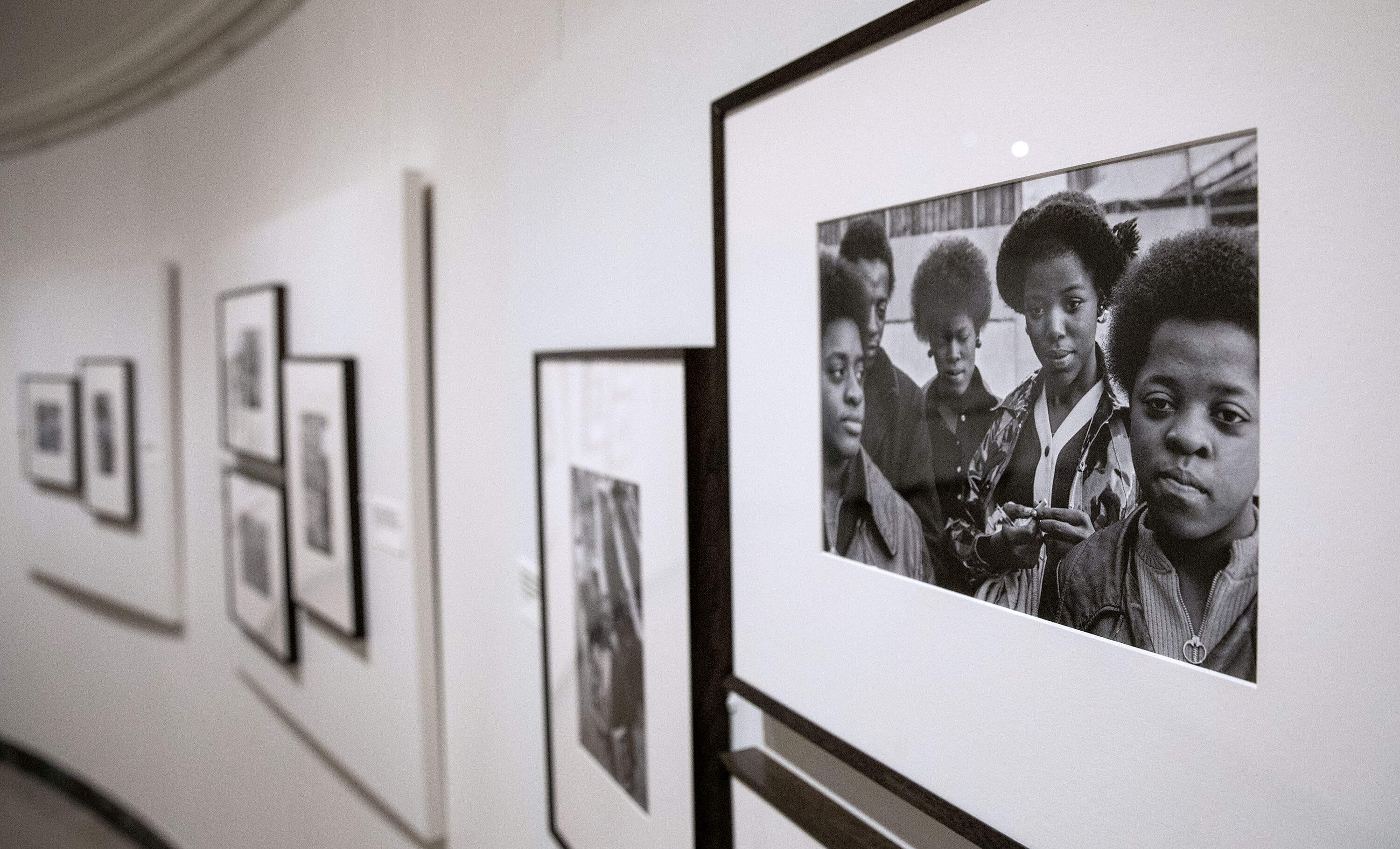 An image at the MFA's &quot;Comrade Sisters&quot; exhibit includes Gail Jones' family members. In the photograph, her sister Jacqueline Hayes and brother Frederick Hayes are on the left, and Gail is on the right. (Robin Lubbock/WBUR)