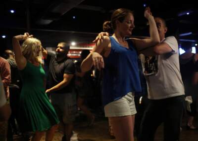 People dance salsa at the now-shuttered Ryles Jazz Club in Cambridge. (Hadley Green for WBUR)