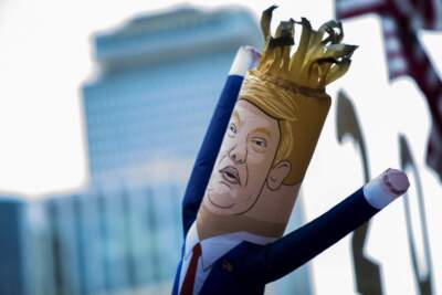 In this 2019 photo, a wacky waving inflatable puppet of Donald Trump twists in the breeze on Boylston Street. (Jesse Costa/WBUR)