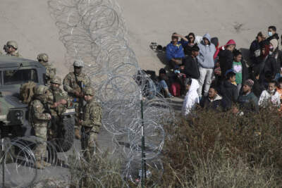 U.S. military stop migrants from crossing into El Paso, Texas, seen from Ciudad Juarez, Mexico. (Christian Chavez/AP)