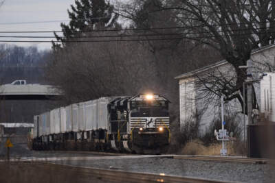 A Norfolk Southern train moves down the tracks in East Palestine, Ohio, on Tuesday, Jan. 30, 2024. Daily life largely returned to normal for residents of East Palestine, Ohio, months after a Norfolk Southern train derailed and spilled a cocktail of hazardous chemicals that caught fire a year ago, but the worries and fears are always there. (Carolyn Kaster/AP)