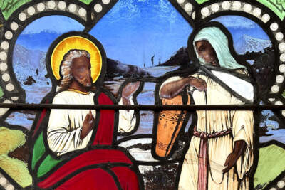 A stained-glass window depicts Christ speaking to a Samaritan woman, in the now-closed St. Mark's Episcopal church in Warren, Rhode Island. (Mark Pratt/AP)