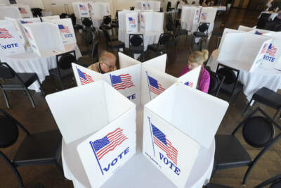 Voters fill out their ballots for the Michigan primary election in Grosse Pointe Farms, Mich., Tuesday, Feb. 27, 2024. Michigan is the last major primary state before Super Tuesday and a critical swing state in November's general election. (AP Photo/Paul Sancya)