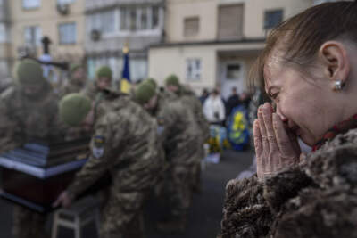 A woman cries during a funeral ceremony of Volodymyr Golubnychyi, Ukrainian senior lieutenant of 72nd Mechanized Brigade, in Kyiv, Ukraine. Golubnychyi was killed during the fighting with Russian forces in Vodyane village, Avdiivka direction. (Evgeniy Maloletka/AP)