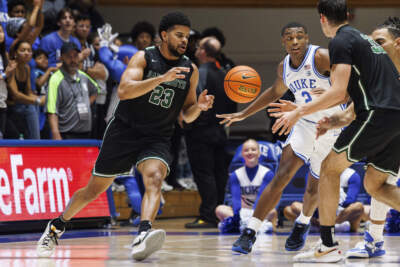 Dartmouth's Robert McRae III (23) takes a pass from Jackson Munro (33) as Duke's Jaylen Blakes (2) defends during the second half of an NCAA college basketball game in Durham, N.C. (Ben McKeown/AP)