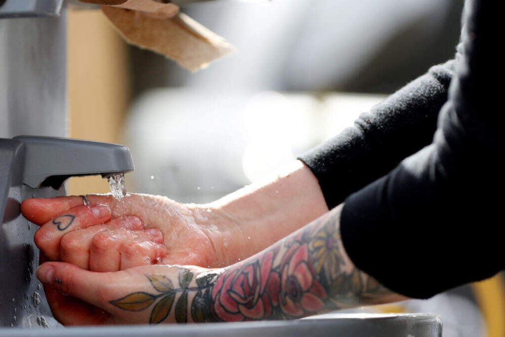 A person washes their hands in Somerville, Massachusetts. (Maddie Meyer/Getty Images)
