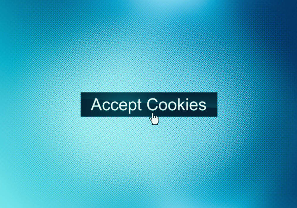 Accept cookies website button on device screen with hand pointer. (Getty)