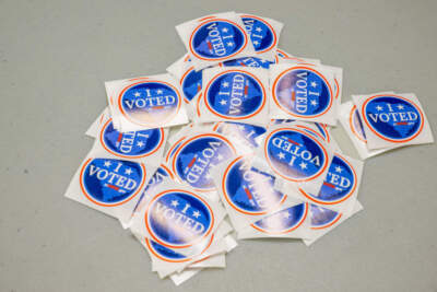 Voting stickers are seen on a table. (Brandon Bell/Getty Images)
