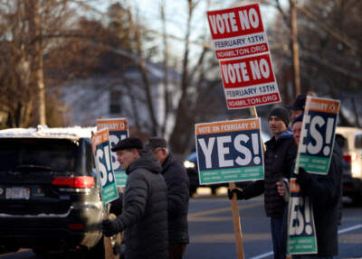 Vote Yes and No signs near the Cunningham Park Community Center in Milton on Feb. 14, 2024. (David L. Ryan/The Boston Globe via Getty Images)