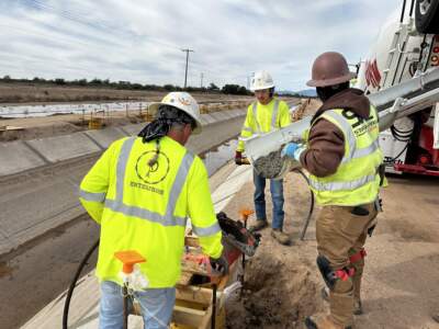 A construction crew at the Casablanca irrigation canal on the Gila River Indian Reservation. (Peter O'Dowd/Here & Now)