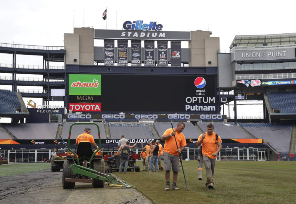 Workers lay sod on the field at Gillette Stadium in preparation for weekend soccer matches ion 2019. (Elise Amendola/AP)