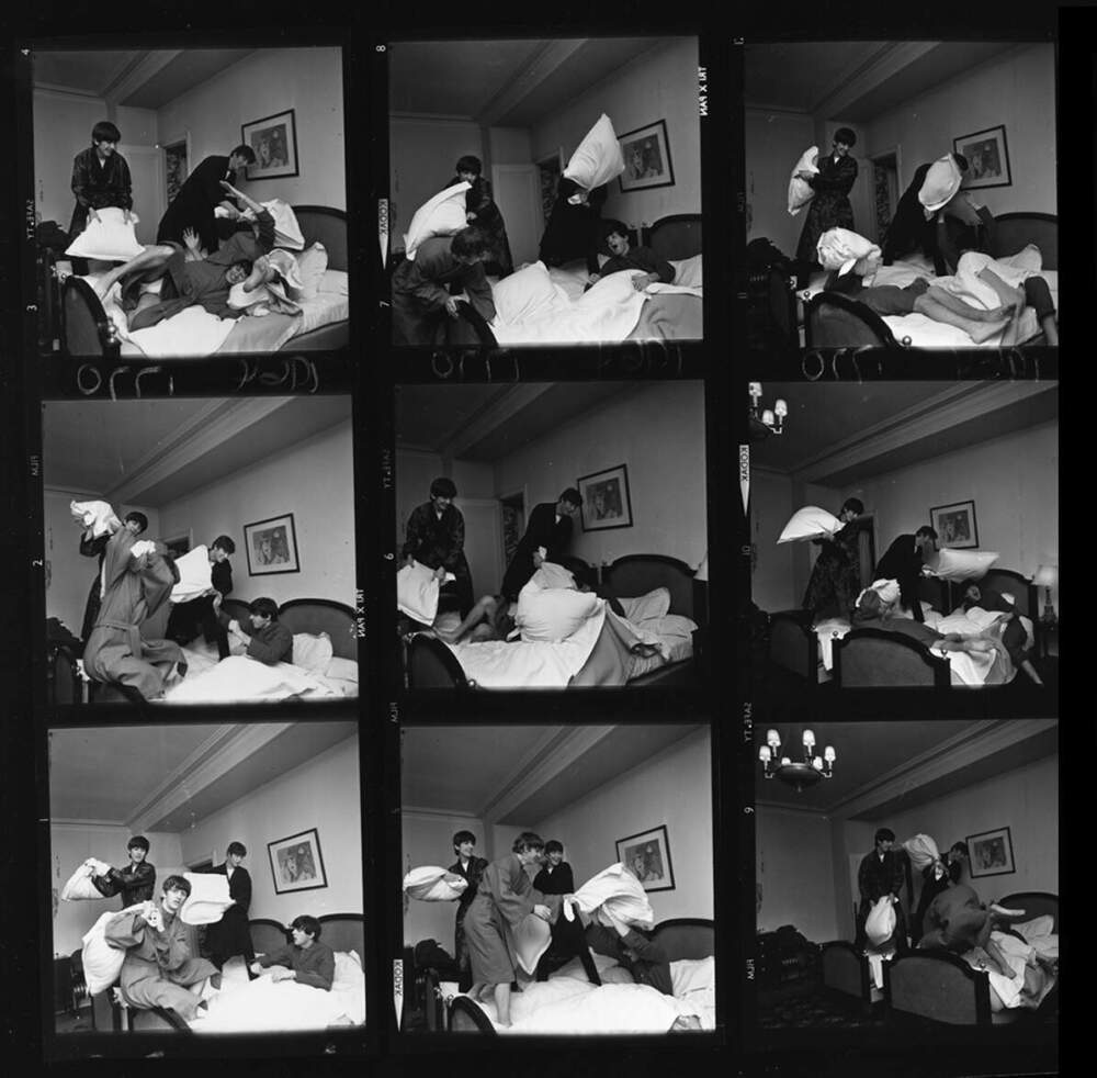 The Beatles have a pillow fight. (Harry Benson)