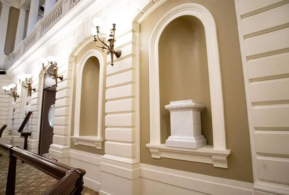 A marble pedestal in the Senate Chamber awaits the new bust of Frederick Douglass, while another alcove (to the left) will eventually be filled with a bust of a woman. (Sam Doran/SHNS)