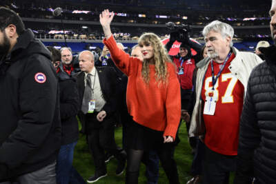 Taylor Swift walks with Ed Kelce after the AFC Championship game. (Nick Wass/AP)