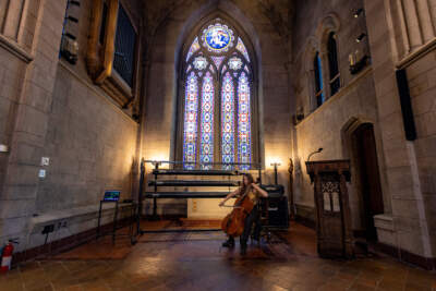 Artist-in-residence Eden Rayz plays the cello during a rehearsal of a composition similar to a Buddhist death meditation at Bigelow Chapel in Mount Auburn Cemetery. (Jesse Costa/WBUR)