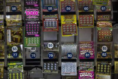 The lottery ticket display behind the counter at College Convenience on Huntington Ave. (Jesse Costa/WBUR)