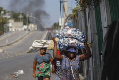 Street vendors run during clashes between police and gangs in Port-au-Prince, Haiti. (Odelyn Joseph/AP)