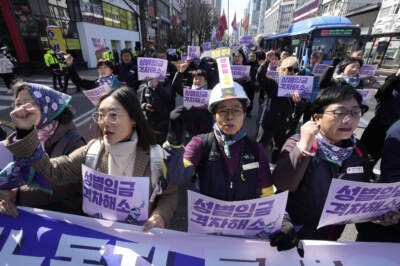 Members of the Korean Confederation of Trade Unions march during a rally marking International Women's Day in Seoul, South Korea. (Ahn Young-joon/AP)