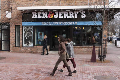 Pedestrians walk past a Ben & Jerry's shop in Burlington, Vermont. (Charles Krupa/AP)