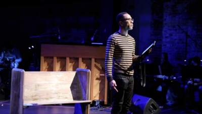 Daniel Callahan performs an early iteration of &quot;Come On In - Live&quot; at Emerson College's Liebergott Black Box Theatre. (Courtesy Anawan Productions)