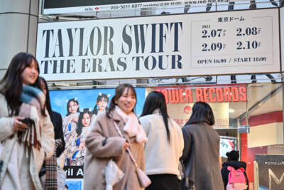Pedestrians walk past advertising for U.S. pop music sensation Taylor Swift in the Shibuya district of Tokyo on Feb. 6, 2024, a day ahead of the first show of her highly anticipated Japan tour. The 14-time Grammy winner on February 7 kicks off the Asia-Pacific leg of her &quot;Eras&quot; world tour with dates in Japan, Australia and Singapore. (Richard A. Brooks/AFP via Getty Images)