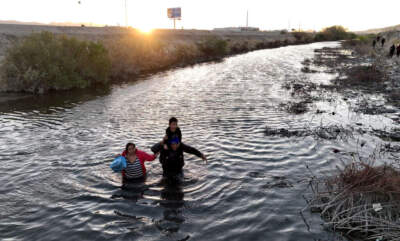 Migrants attempting to cross the North American side of the border between El Paso, Texas, and Ciudad Juarez, Mexico, on March 3, 2024. (Lokman Vural Elibol/Anadolu via Getty Images)