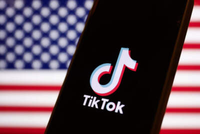 American flag displayed on a laptop screen and TikTok logo displayed on a phone screen are seen in this illustration photo taken in Warsaw, Poland on March 14, 2024. (Jakub Porzycki/NurPhoto via Getty Images)