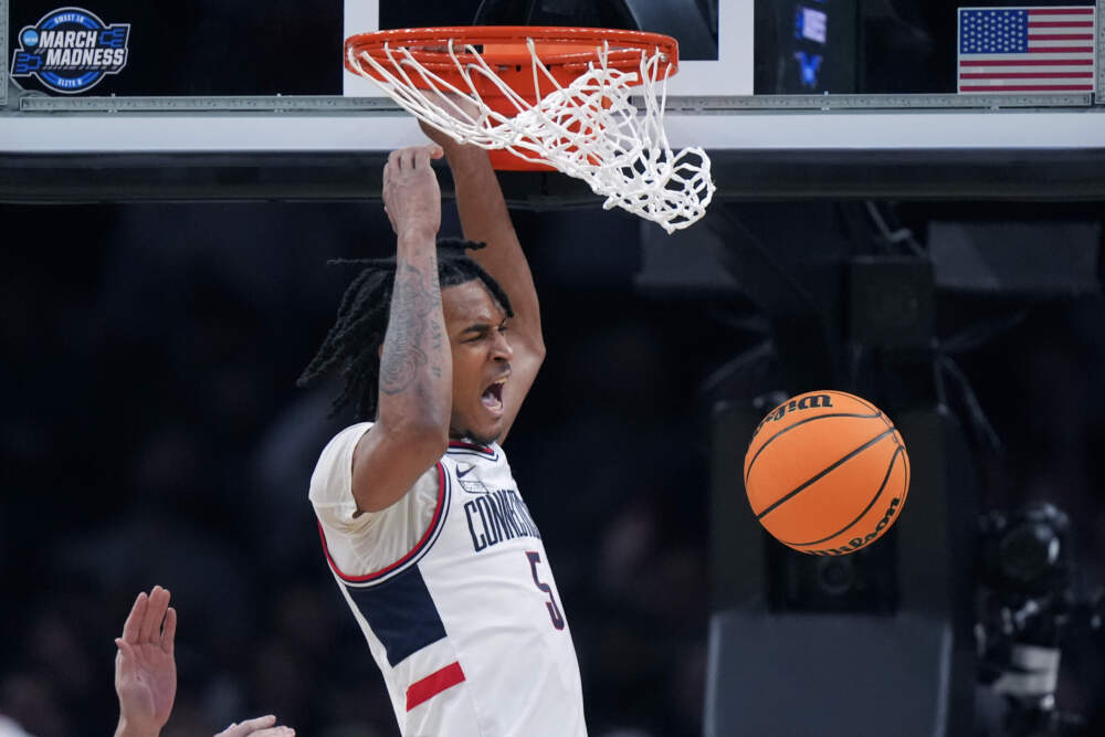 UConn guard Stephon Castle (5) roars while dunking against San Diego State during the second half of the Sweet 16 college basketball game in the men's NCAA Tournament, Thursday, March 28, 2024, in Boston. (Steven Senne/AP)