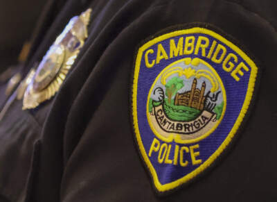 The patch of a Cambridge police officer during a special Cambridge City Council meeting about the police killing of Sayed Faisal in the Sullivan Chamber at Cambridge City Hall. (Matthew J. Lee/The Boston Globe via Getty Images)