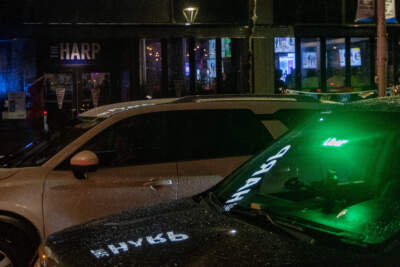 An Uber driver passes by The Harp on Causeway Street. (Jesse Costa/WBUR)