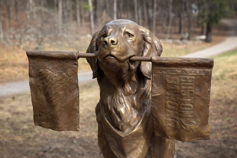 Spencer, a therapy dog from Holliston, was named the Official Dog of the 126th Boston Marathon in 2022. His statue faces marathon runners as they enter Ashland along Route 135. (Robin Lubbock/WBUR)