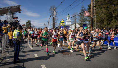 The Boston Marathon's first wave of non-elite runners start the race in Hopkinton. (Robin Lubbock/WBUR)