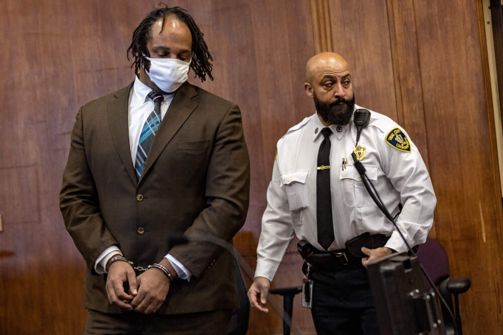 Alvin Campbell is brought into Suffolk Superior Court in handcuffs for a 2023 hearing in his ongoing case. He's accused of raping eight women and attempting to rape a ninth. (Jesse Costa/WBUR)