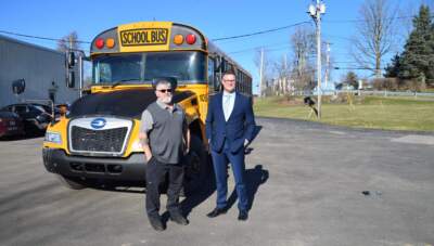 Alexandria Bay's Transportation Director Delmar Lambert and Superintendent Chris Clapper have been instrumental in starting to electrify the rural town's school district buses. (Amy Feiereisel/NCPR)