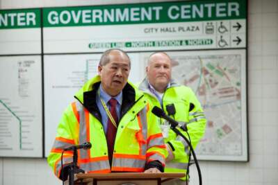 MBTA General Manager Phil Eng speaks to reporters from a podium set up on the Green Line platform at Government Center on Feb. 15, 2024. (Chris Lisinski/SHNS)