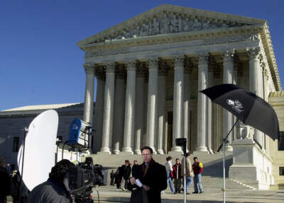 NBC's Pete Williams reports from outside the Supreme Court in Washington in this Dec. 4, 2000 file photo. The Supreme Court's stunning decision that all but declared George Bush president provoked warnings that the court had grievously wounded itself with partisan divisions. A year later, those fears seem unfounded and there is no sign of enmity among the justices. (Dennis Cook/AP)