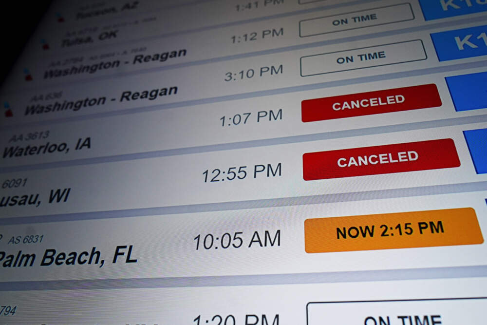 American Airlines flight information screen displays cancelled flights. (Nam Y. Huh/AP)