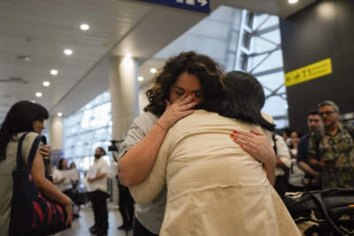 María Hastings, who lives in Tampa, FL, embraces for first time her biological mother upon her arrival to the airport in Santiago, Chile, on a trip organized by Connecting Roots, an organization that helps reunite with their Chilean biological families children who were taken to be put up for adoption during the dictatorship of Gen. Augusto Pinochet. (Esteban Felix/AP)