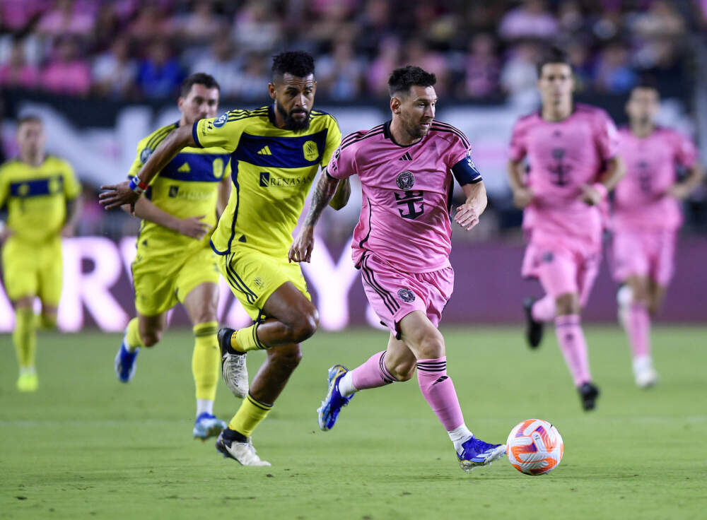Inter Miami forward Lionel Messi races ahead of Nashville SC midfielder Anibal Godoy during the first half of a CONCACAF Champions Cup soccer match in March. (Michael Laughlin/AP)