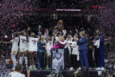 South Carolina players and coaches celebrate after the Final Four college basketball championship game against Iowa in the women's NCAA Tournament. (Carolyn Kaster/AP)