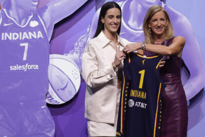 owa's Caitlin Clark, left, poses for a photo with WNBA commissioner Cathy Engelbert, right, after being selected first overall by the Indiana Fever during the first round of the WNBA basketball draft, Monday, April 15, 2024, in New York. (Adam Hunger/AP)