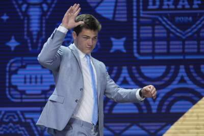 North Carolina quarterback Drake Maye walks on stage during the first round of the NFL football draft, Thursday, April 25, 2024, in Detroit. (Jeff Roberson/AP)