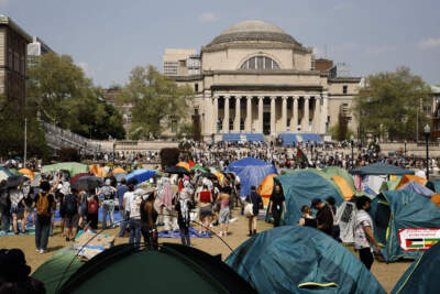 Student protesters gather in protest inside their encampment on the Columbia University campus. (Stefan Jeremiah/AP)