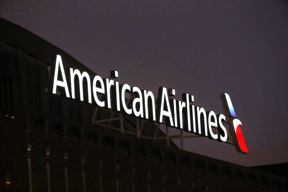 The American Airlines logo is stands atop the American Airlines Center in Dallas. (Michael Ainsworth/AP)