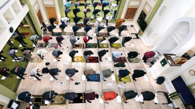 Worshipers bow in prayer in the mosque of The Islamic Society of Boston during the holy month of Ramadan. (Charles Krupa/AP)